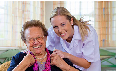 Personal support worker helping elderly person at home